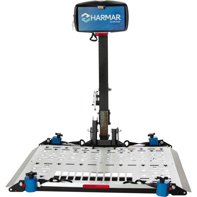 Harmar vehicle lift platform with a sturdy frame and a control box attached to a vertical post.